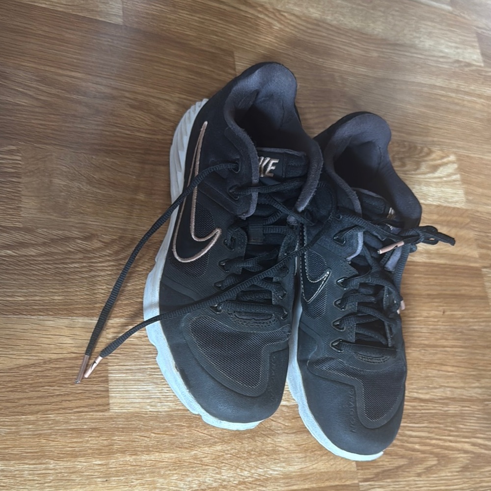 Nike Black and rose gold tuff shoes with White soles